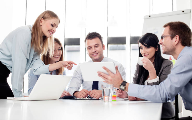 Group of business people working with digital tablet in office